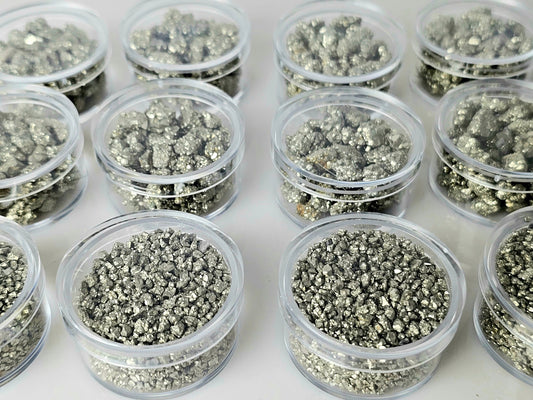 Pyrite crystals in display case