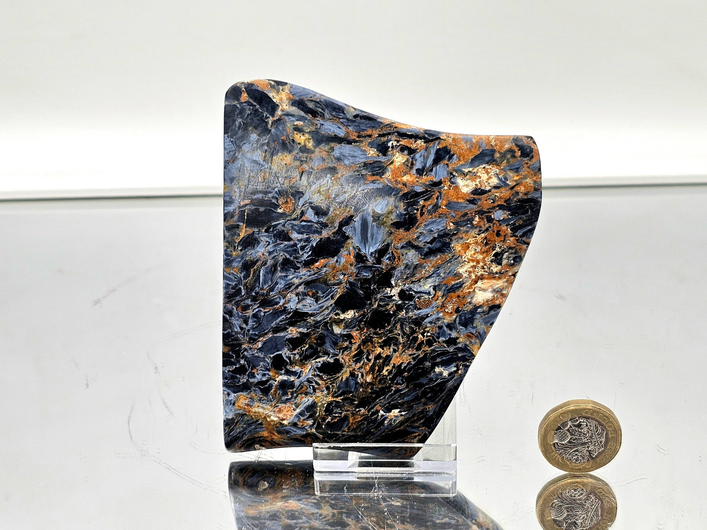 Natural pietersite slice with deep blue, bronze, and gold color layers