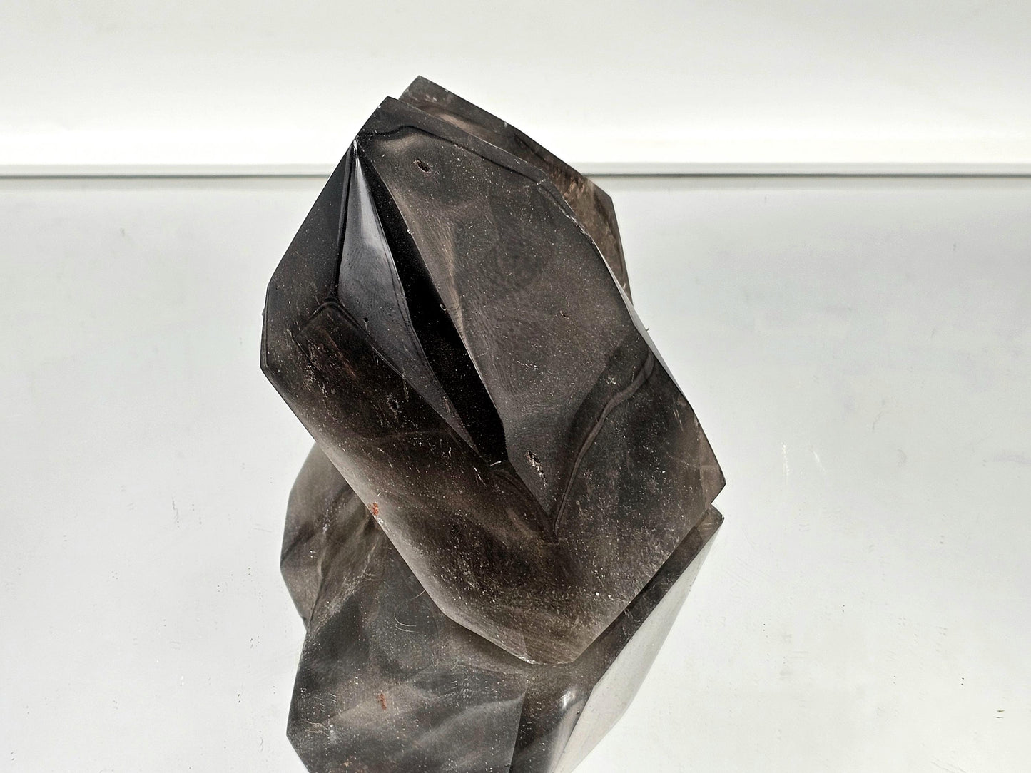 Large smoky quartz crystal, ideal for enhancing modern and rustic interiors."