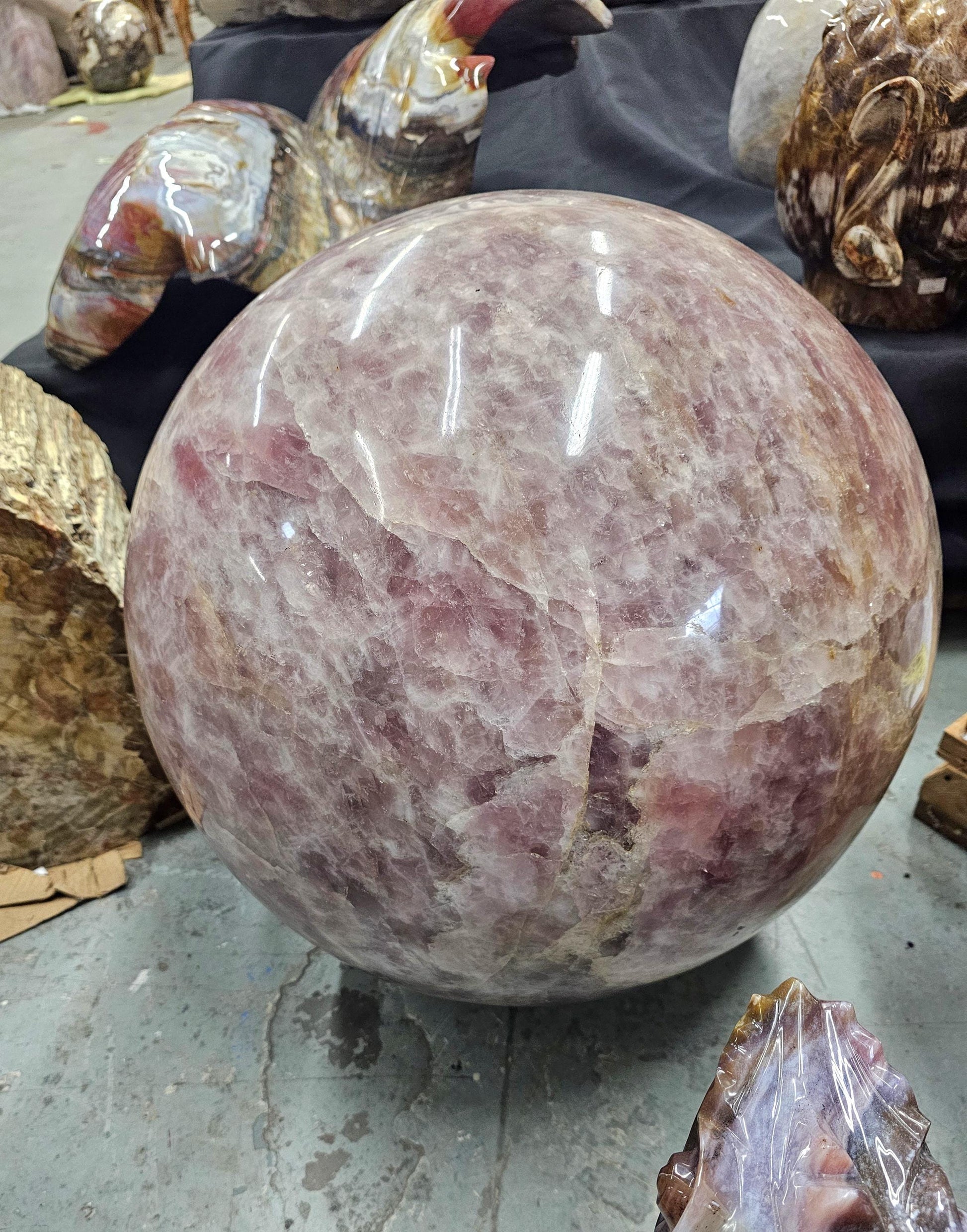 Close-up of a giant rose quartz crystal sphere from Madagascar with stunning colour