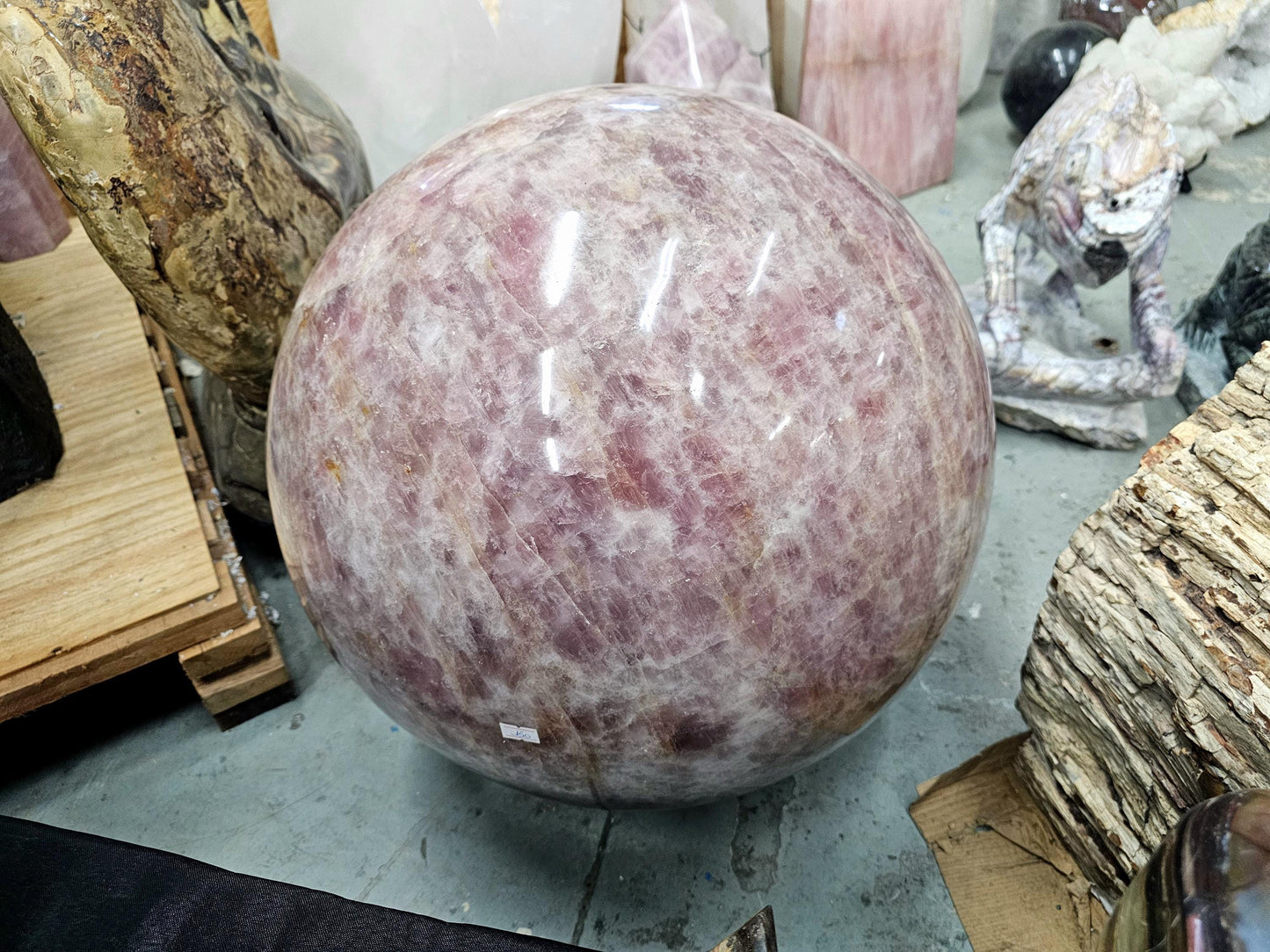 Madagascar-sourced rose quartz crystal sphere radiating harmonious energy in a meditation space