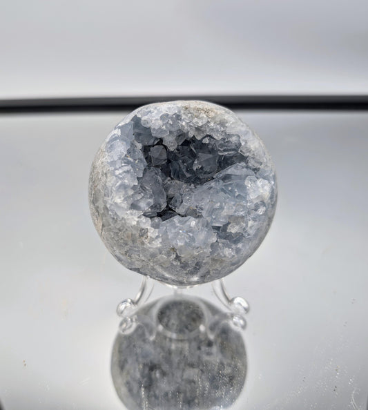 Celestite Crystal Ball used as an energy stone in spiritual practices.