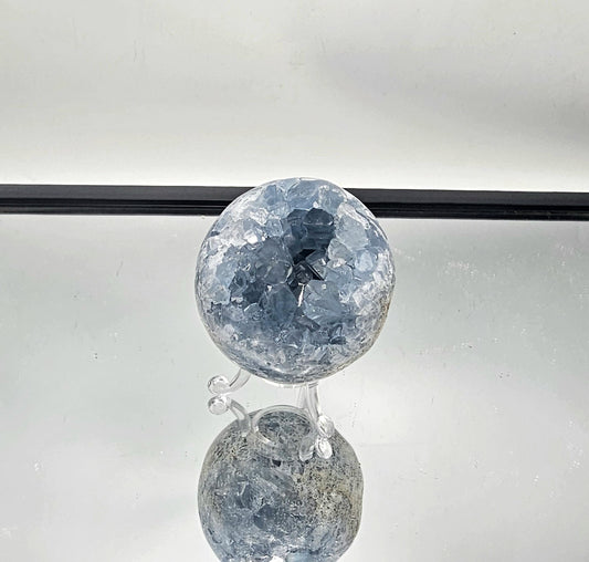 Celestite Crystal Sphere, hand-polished in Madagascar with soft blue hues.