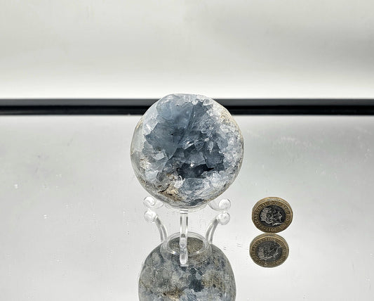 Celestite Sphere placed as a peaceful accent in living room décor.