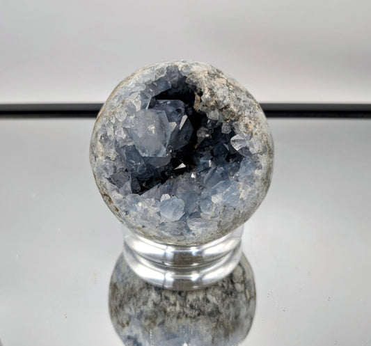 Modern home décor featuring a polished Celestite Crystal Sphere.