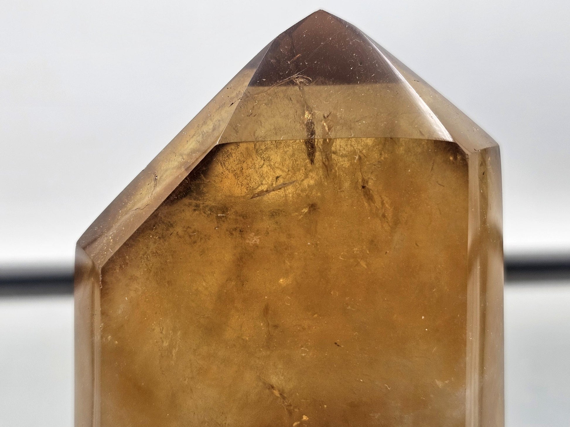 Citrine crystal prism radiating energy for home decor.