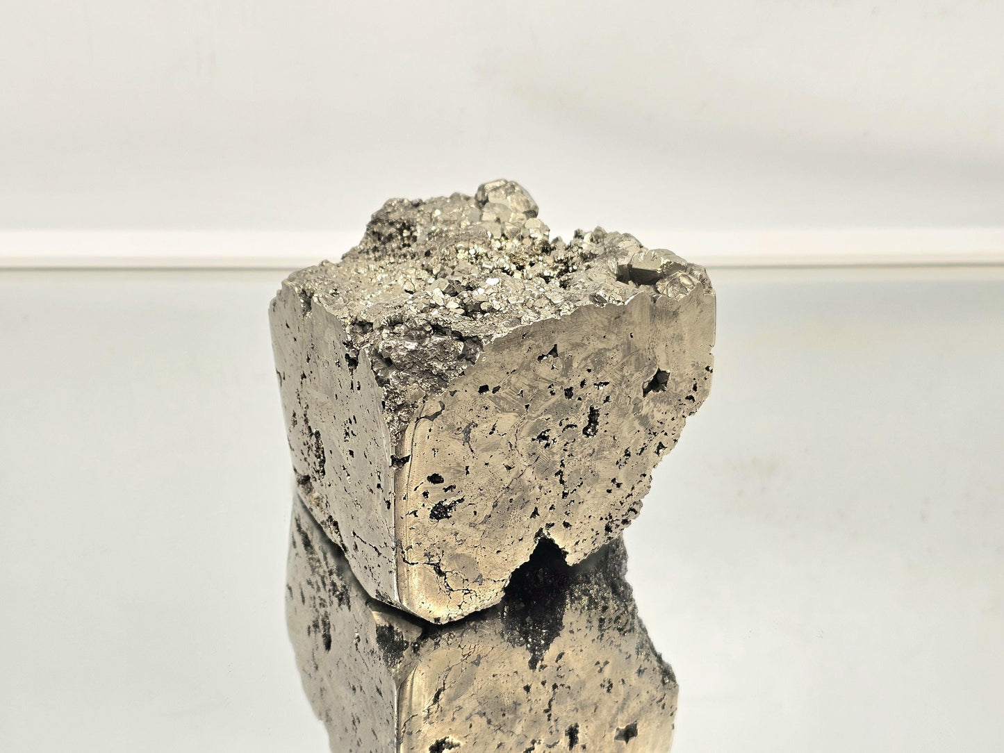 Unique pyrite cube with sharp edges and smooth surfaces