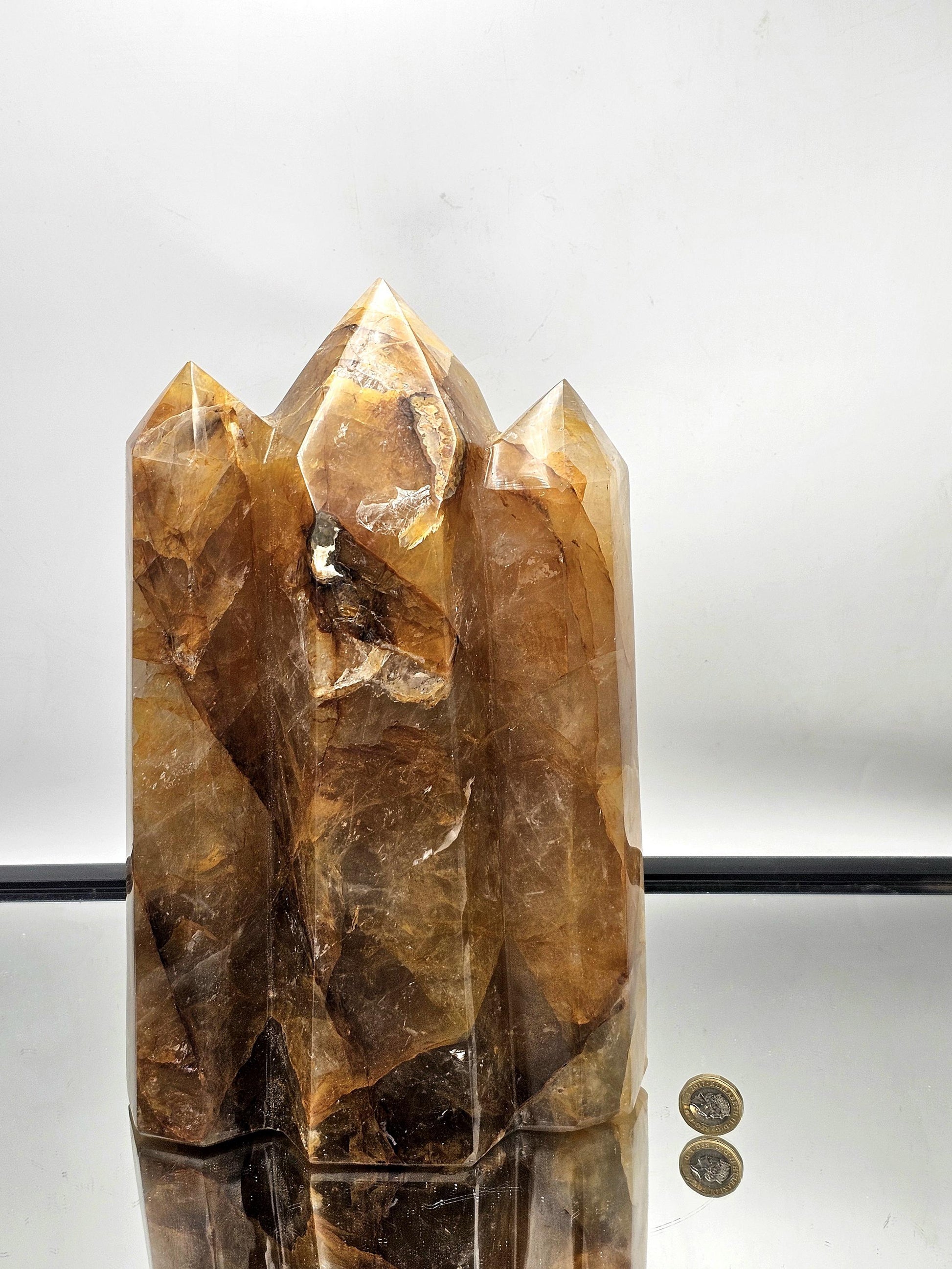 Madagascar-sourced Golden Healer Crystal Triple Prism, showcasing unique craftsmanship and vibrant hues.