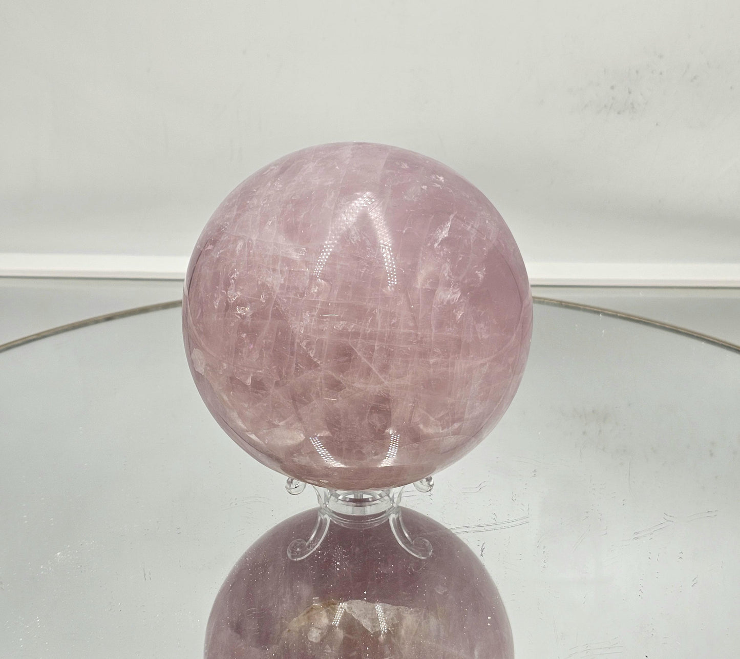 High-quality star rose quartz sphere with mesmerizing asterism