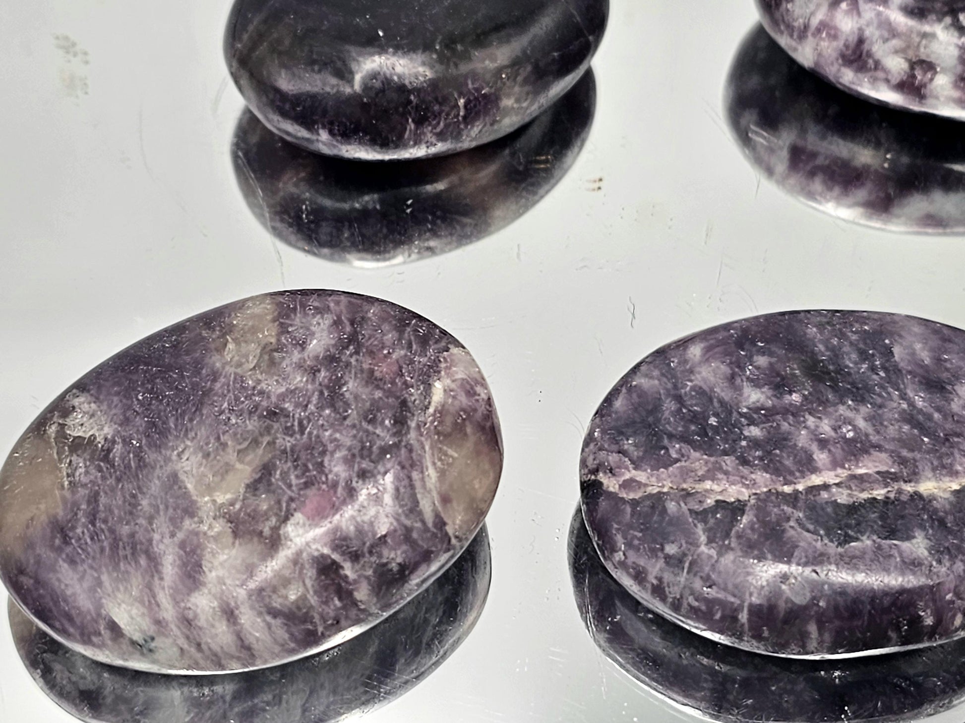 smooth high quality lepidolite crystal palmstones from Distinction Crystals