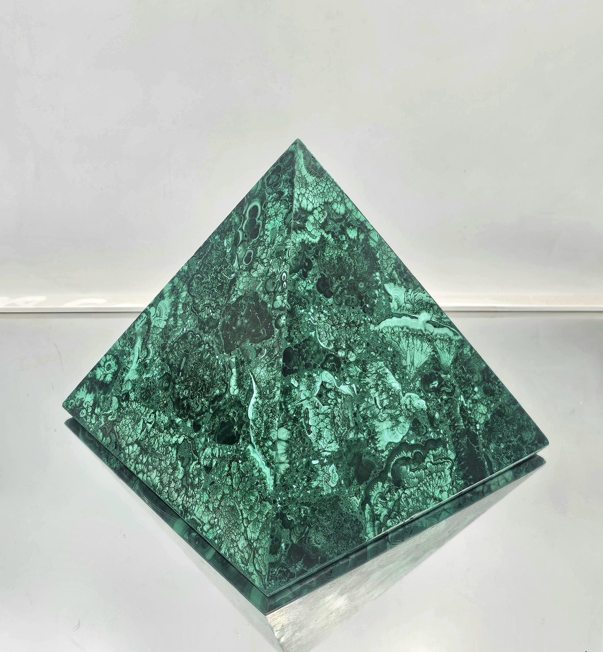 large Malachite pyramid for upscale interior design and crystal enthusiasts.