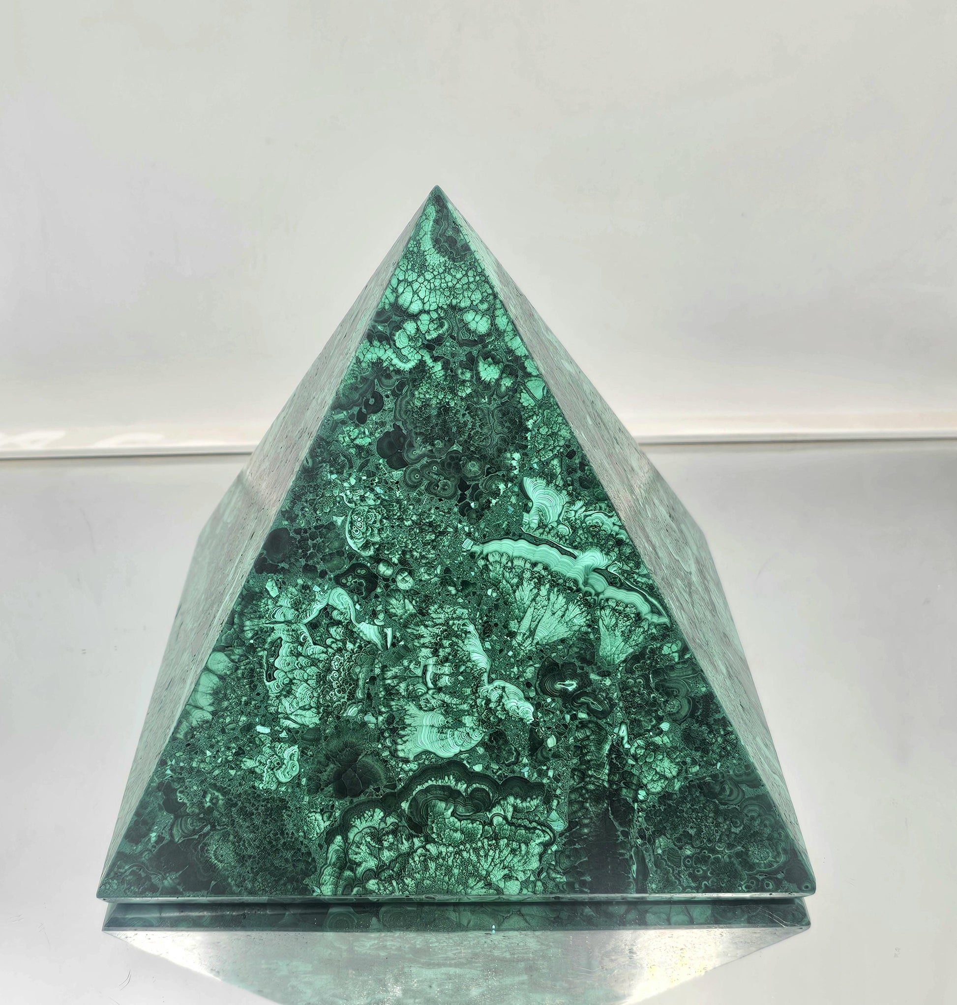 large Artisanal malachite pyramid expertly crafted for refined spaces.
