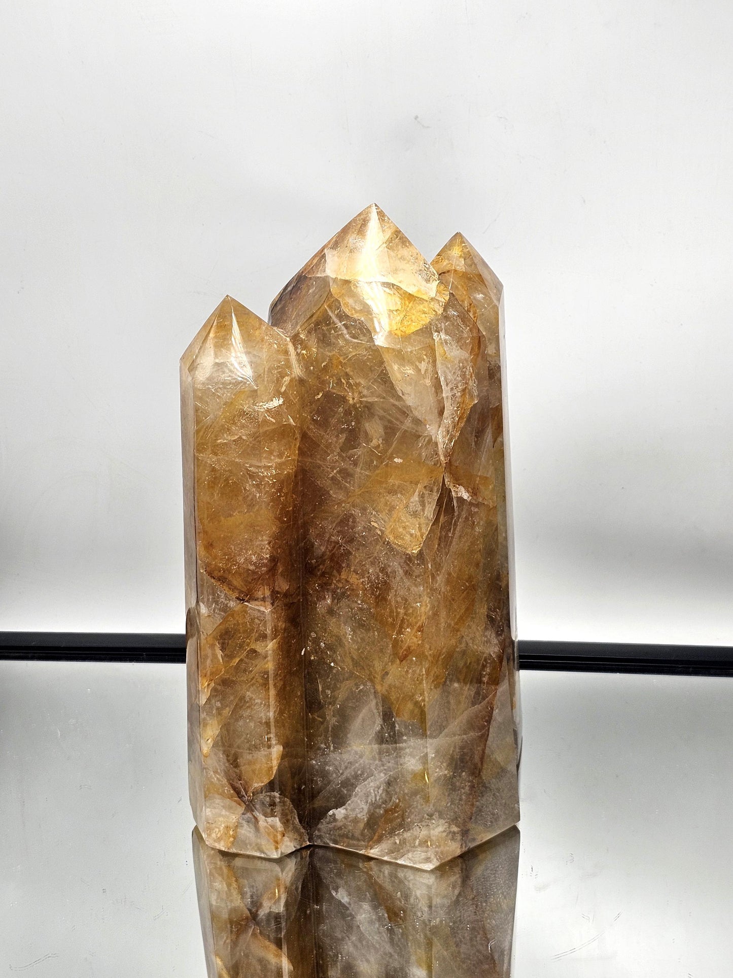 Large Golden Healer Crystal Prism, a striking display piece for home or office interiors.