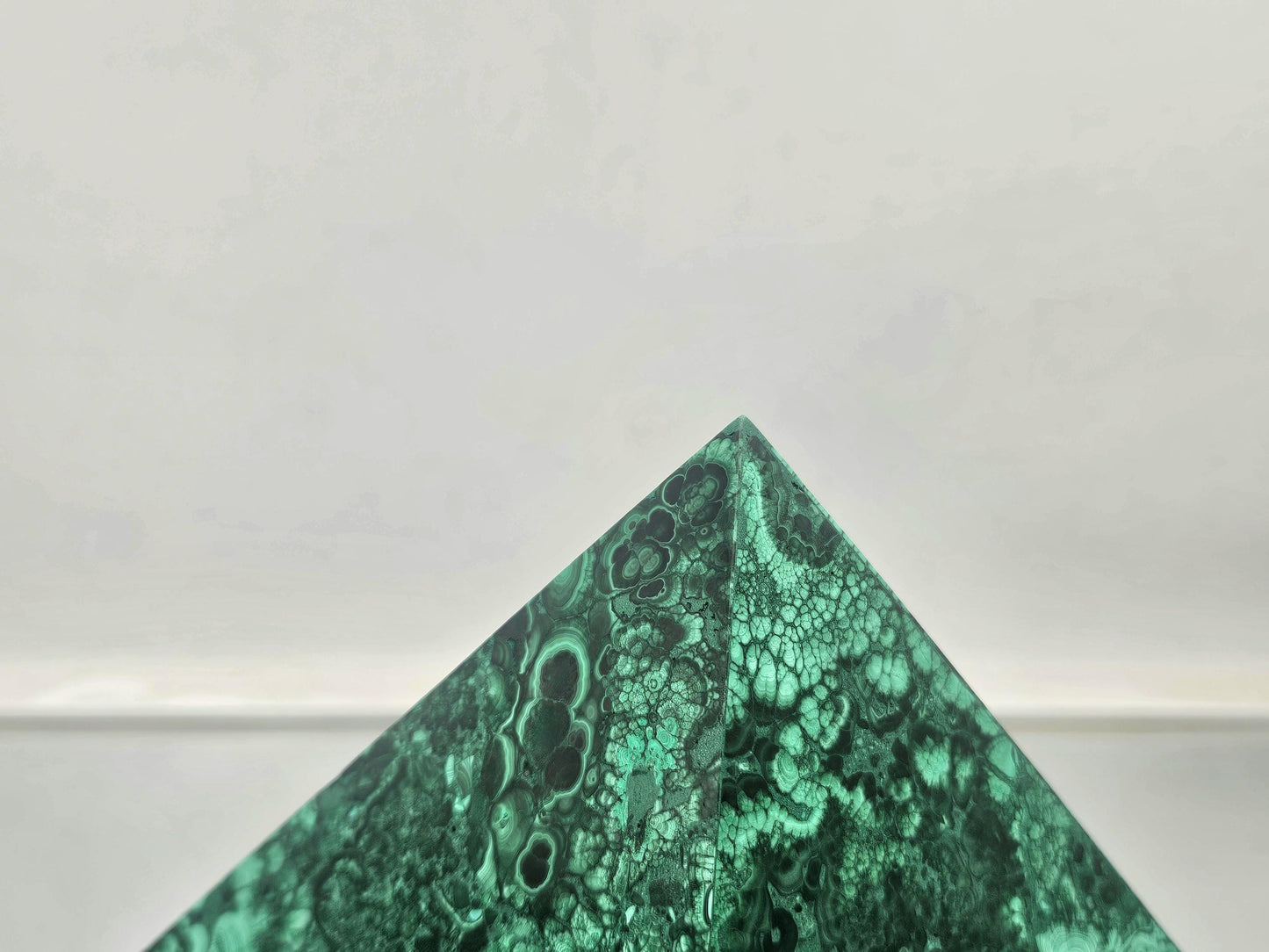 large malachite pyramid with stunning green hues for elegant interiors