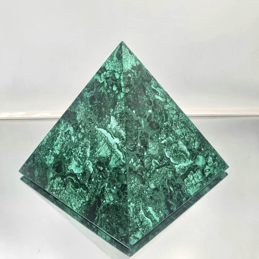 large malachite pyramid with rich green bands, perfect for luxury interior design.