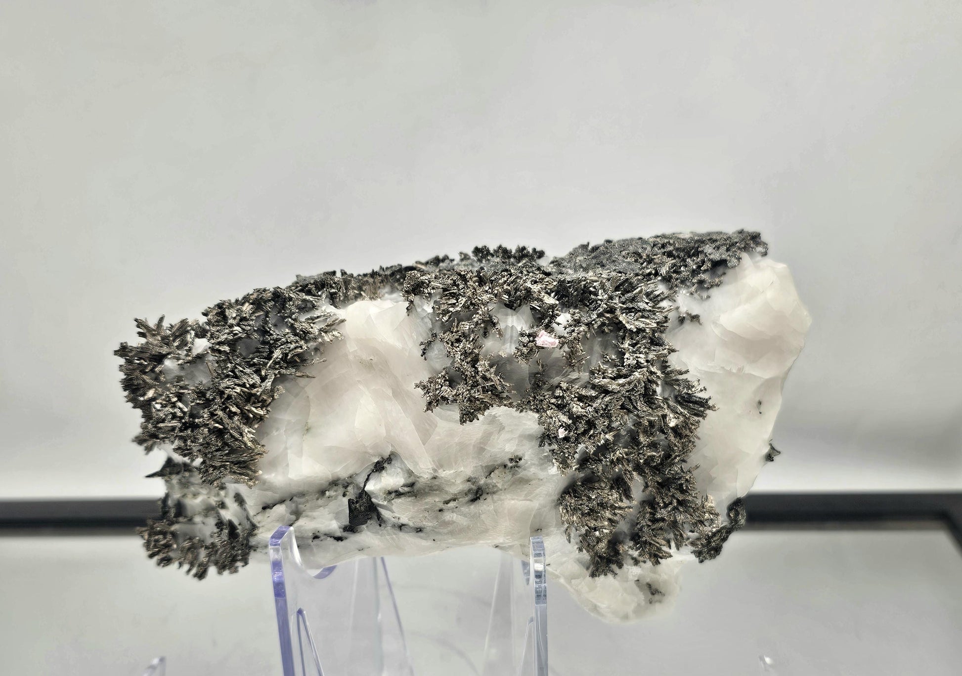 Large native silver on calcite matrix crystal for elegant interior decor displays.