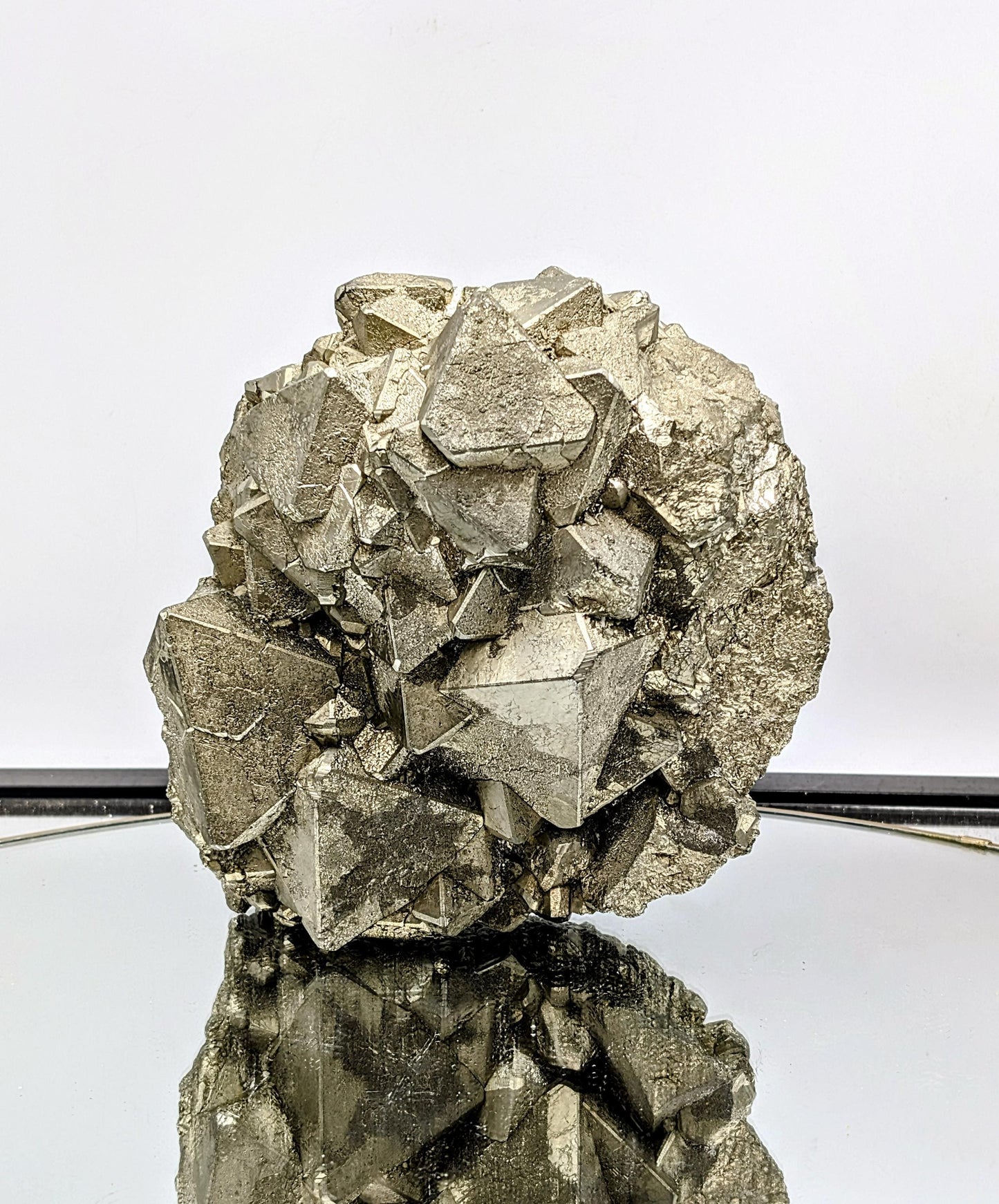 Large octahedral Pyrite crystal with sharp metallic formations.