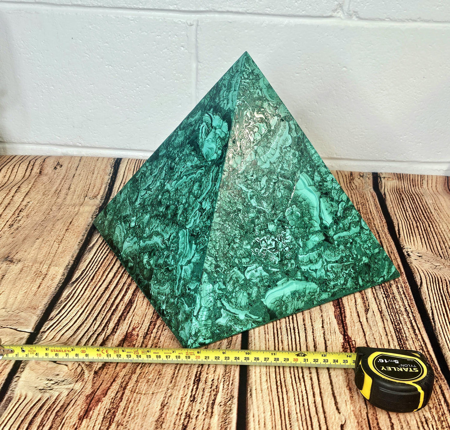 Luxury home décor malachite pyramid showcasing natural beauty.