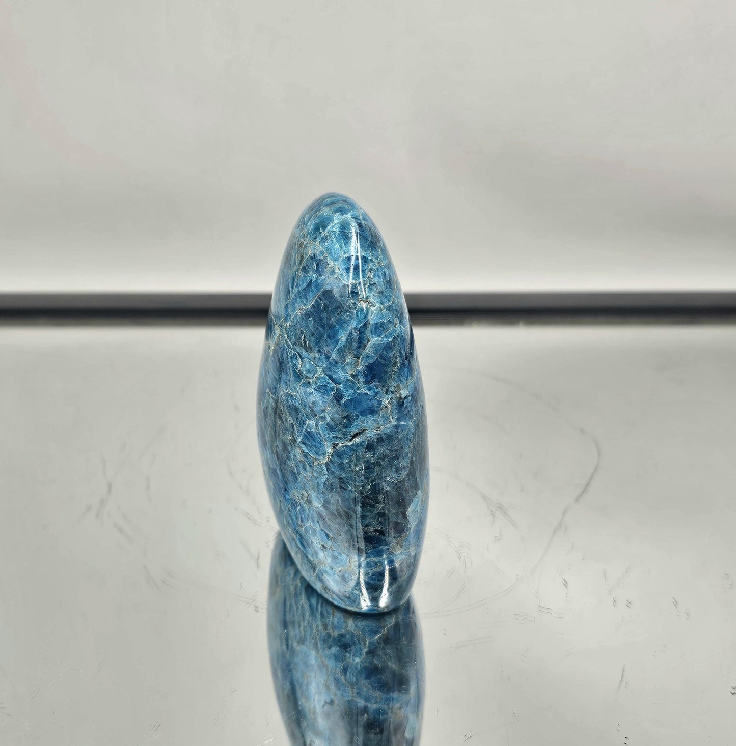 Stunning Blue Apatite freeform crystal from Madagascar with vibrant blue hues.