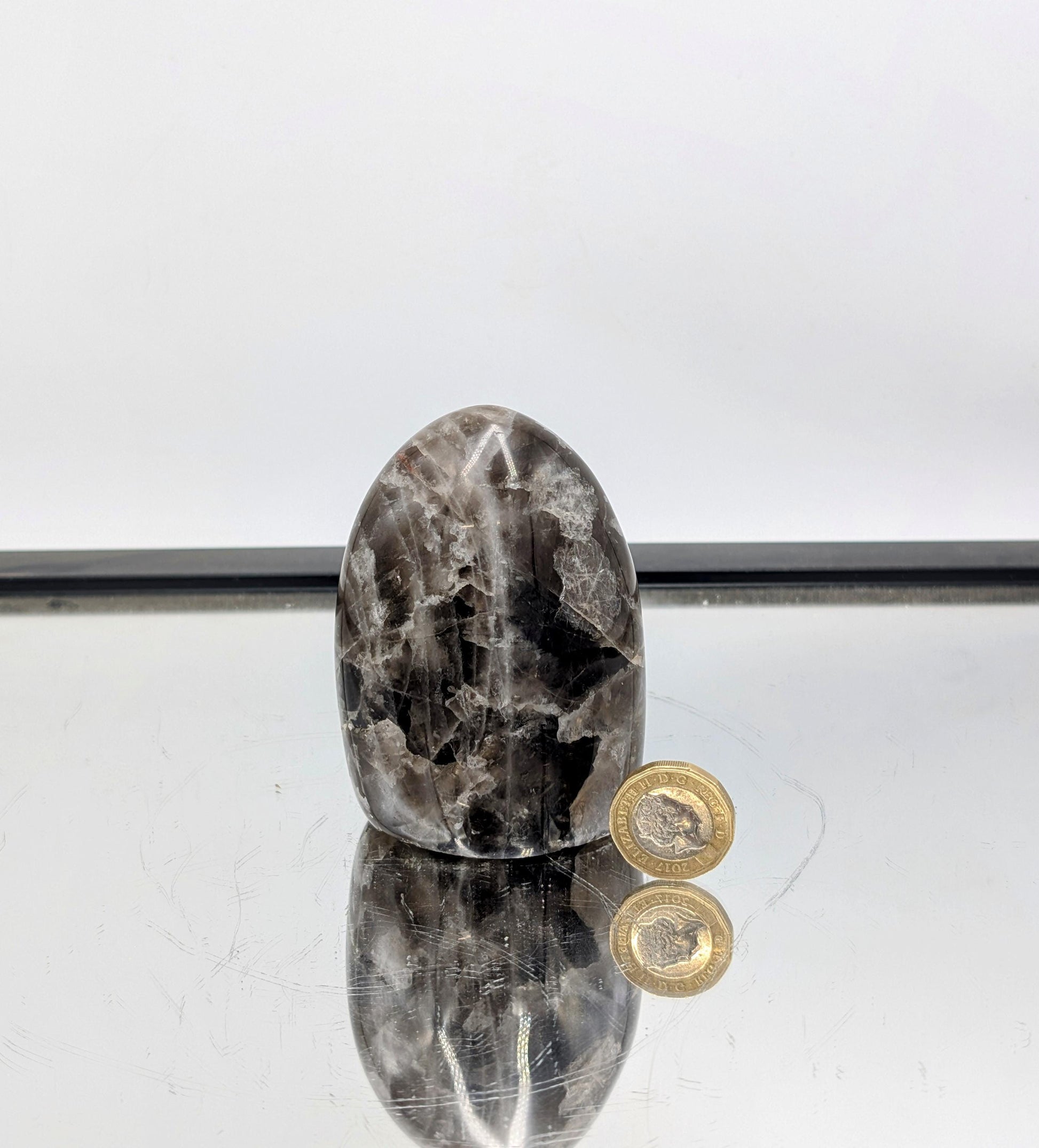 Smoky Quartz freeform sourced from Madagascar, featuring a natural dark color.