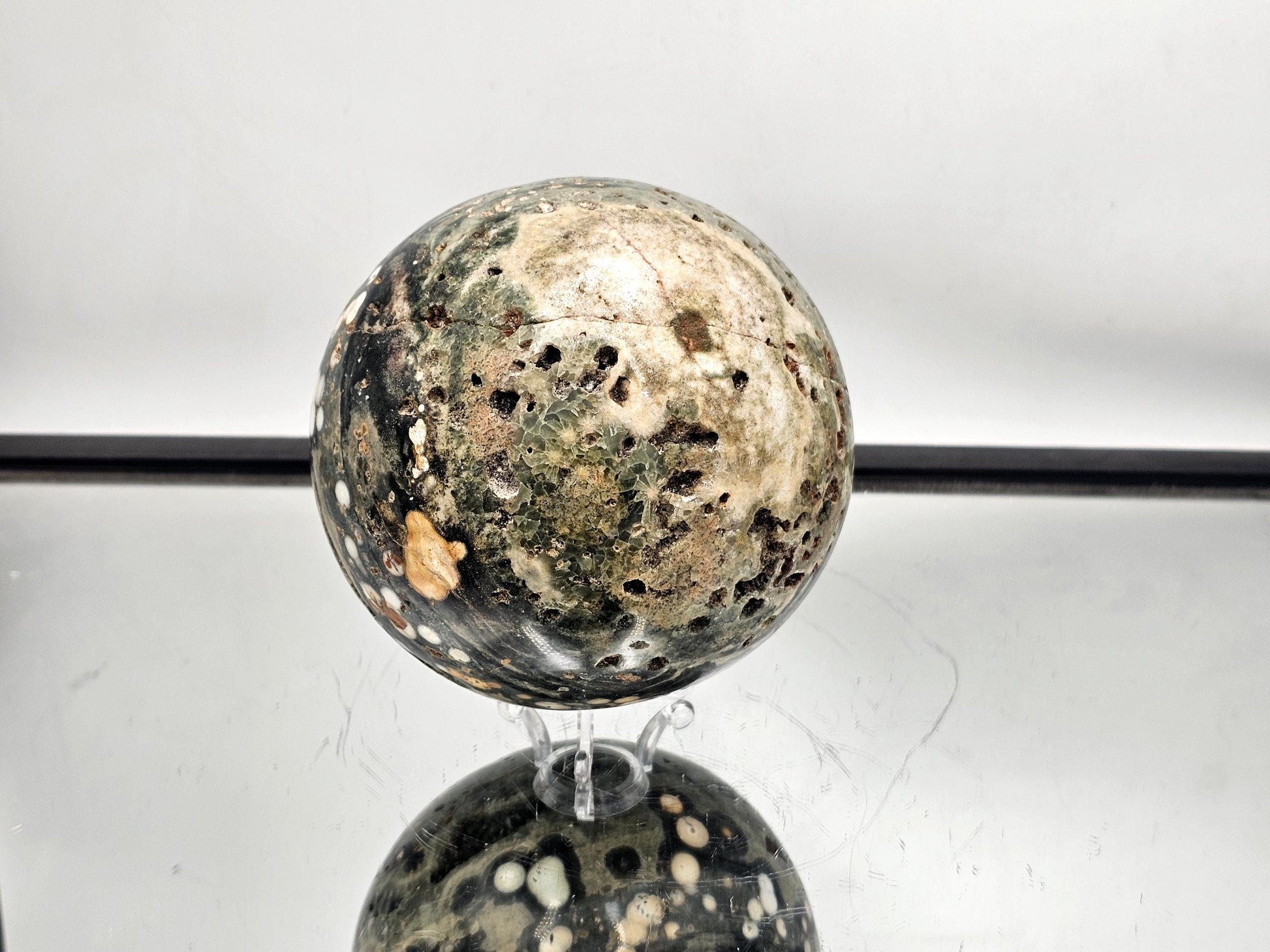 Polished Ocean Jasper sphere crafted from Madagascar