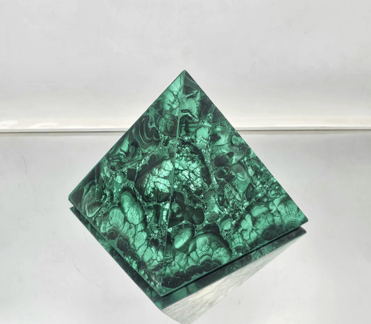 medium artisanal malachite pyramid expertly crafted for refined spaces.
