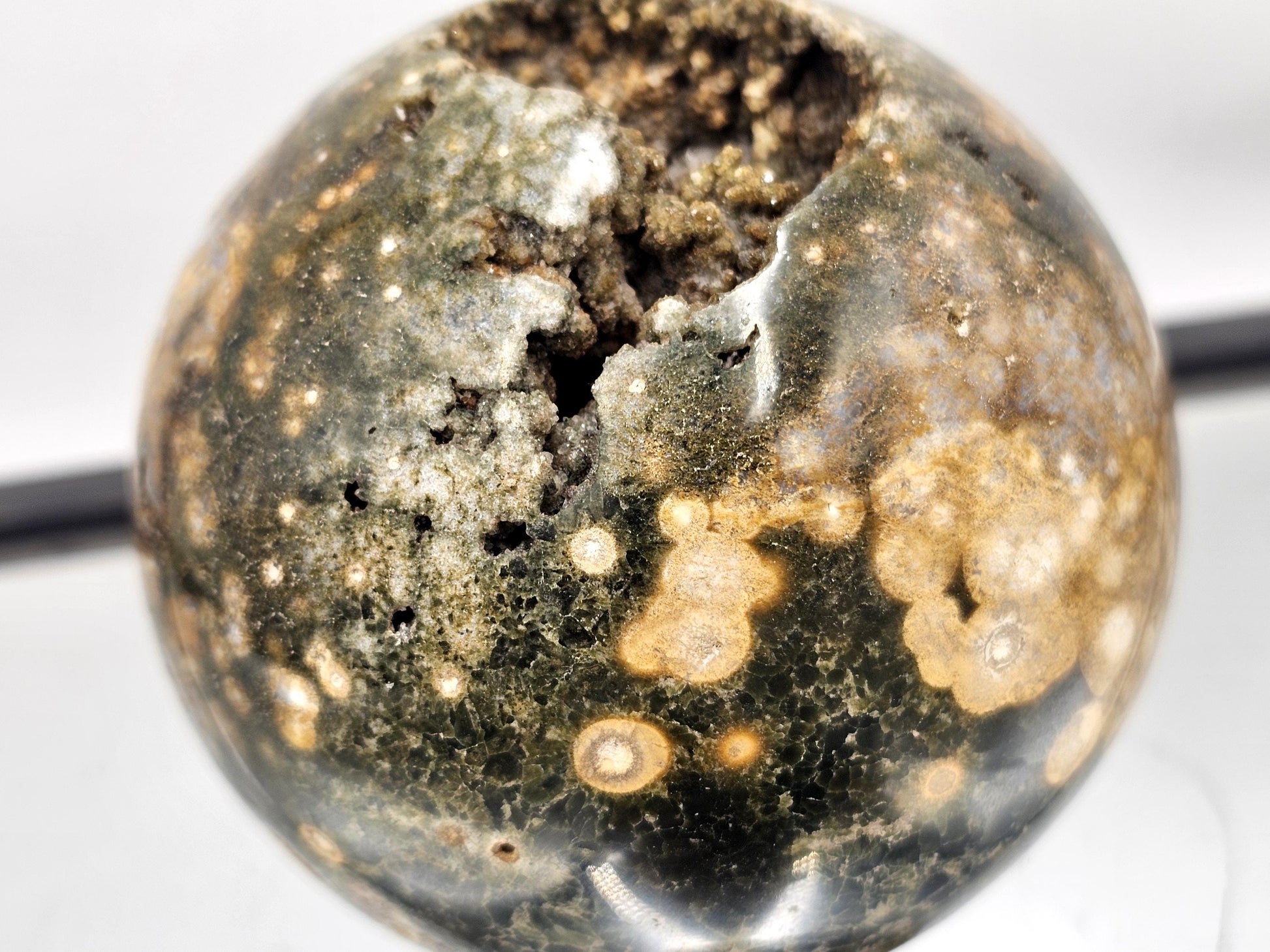 Natural Ocean Jasper crystal sphere with intricate designs