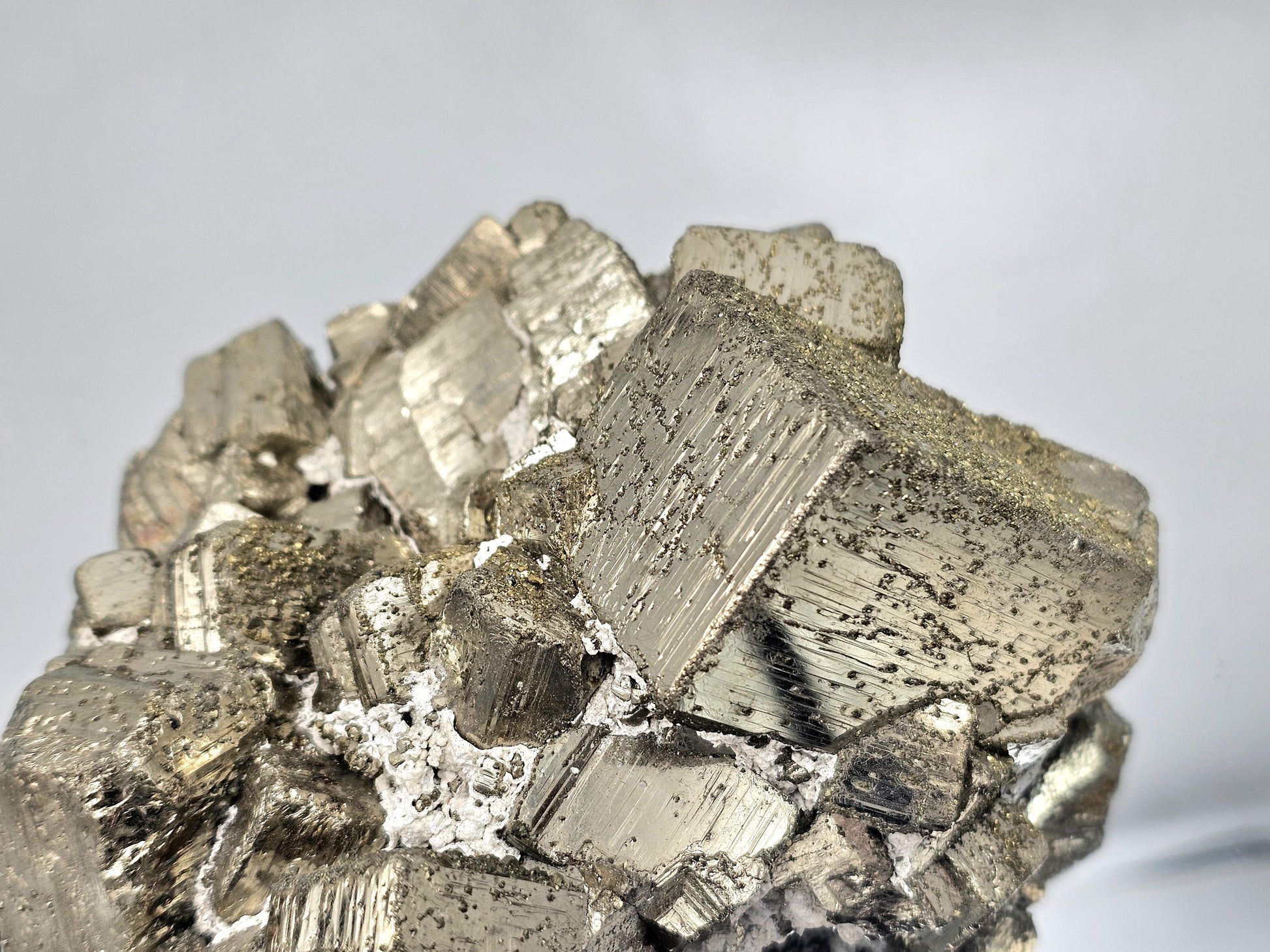 Natural Pyrite cluster crystal with intricate cubic formations and high luster.