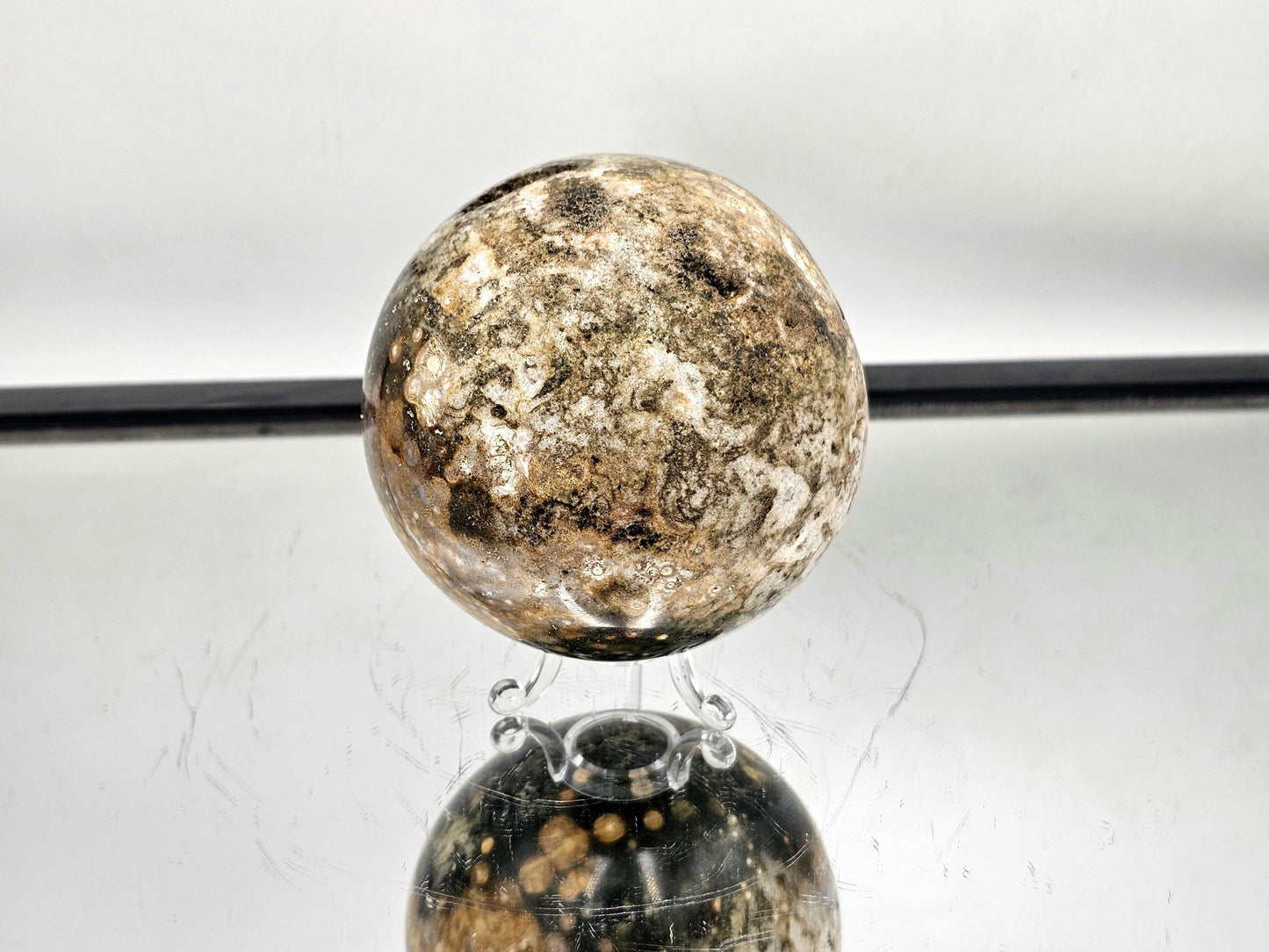 Orbital Jasper sphere with unique natural cavities