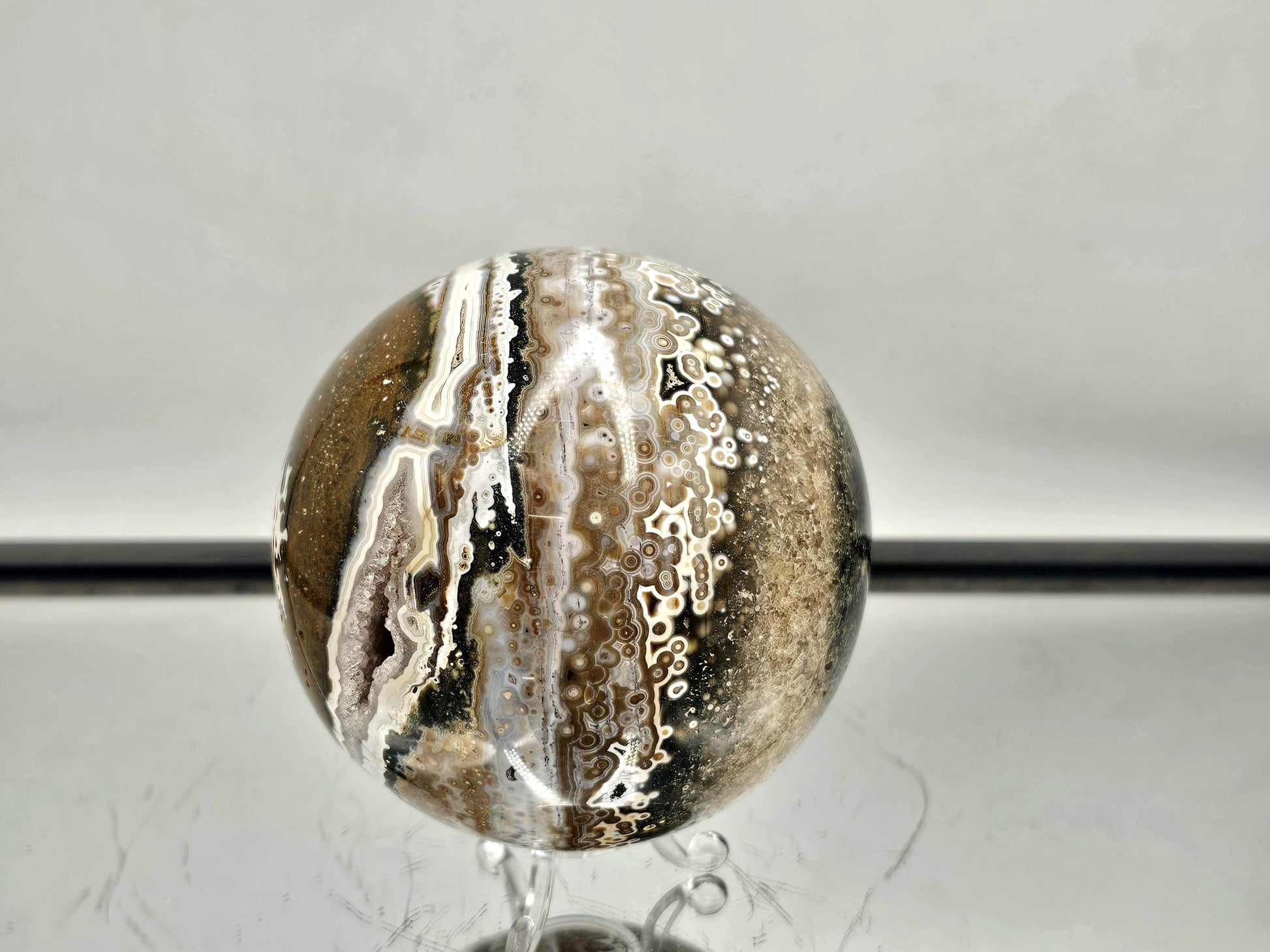 Orbital Ocean Jasper sphere with intricate natural patterns