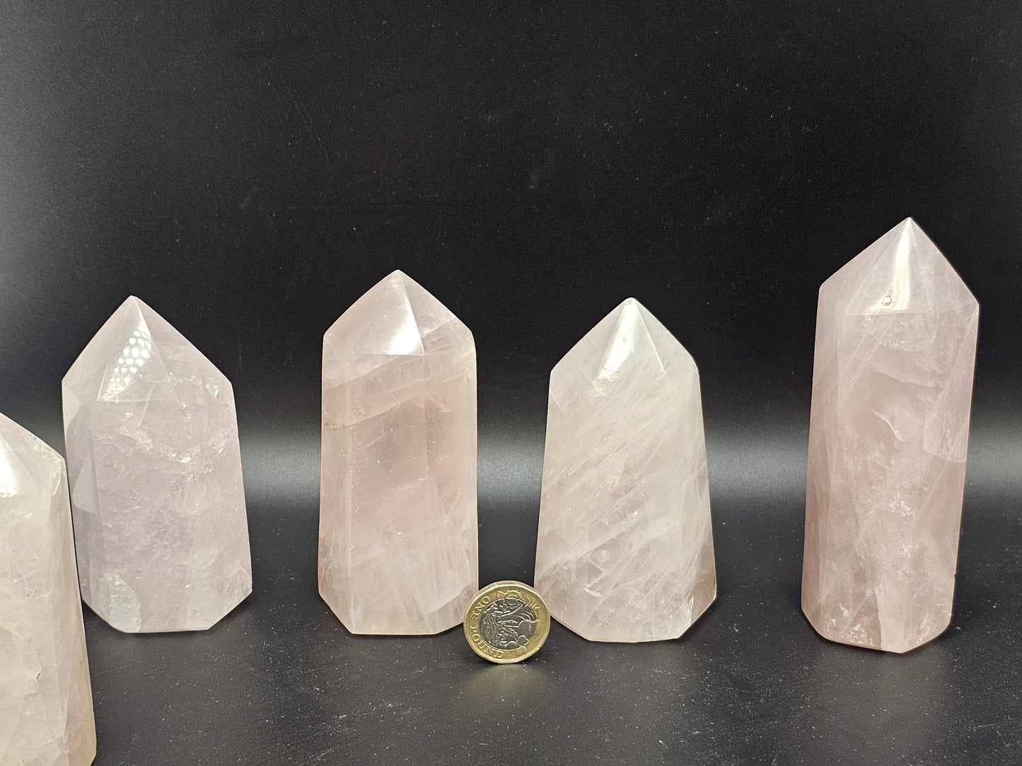 Polished small Rose Quartz tower, ideal for crystal displays.
