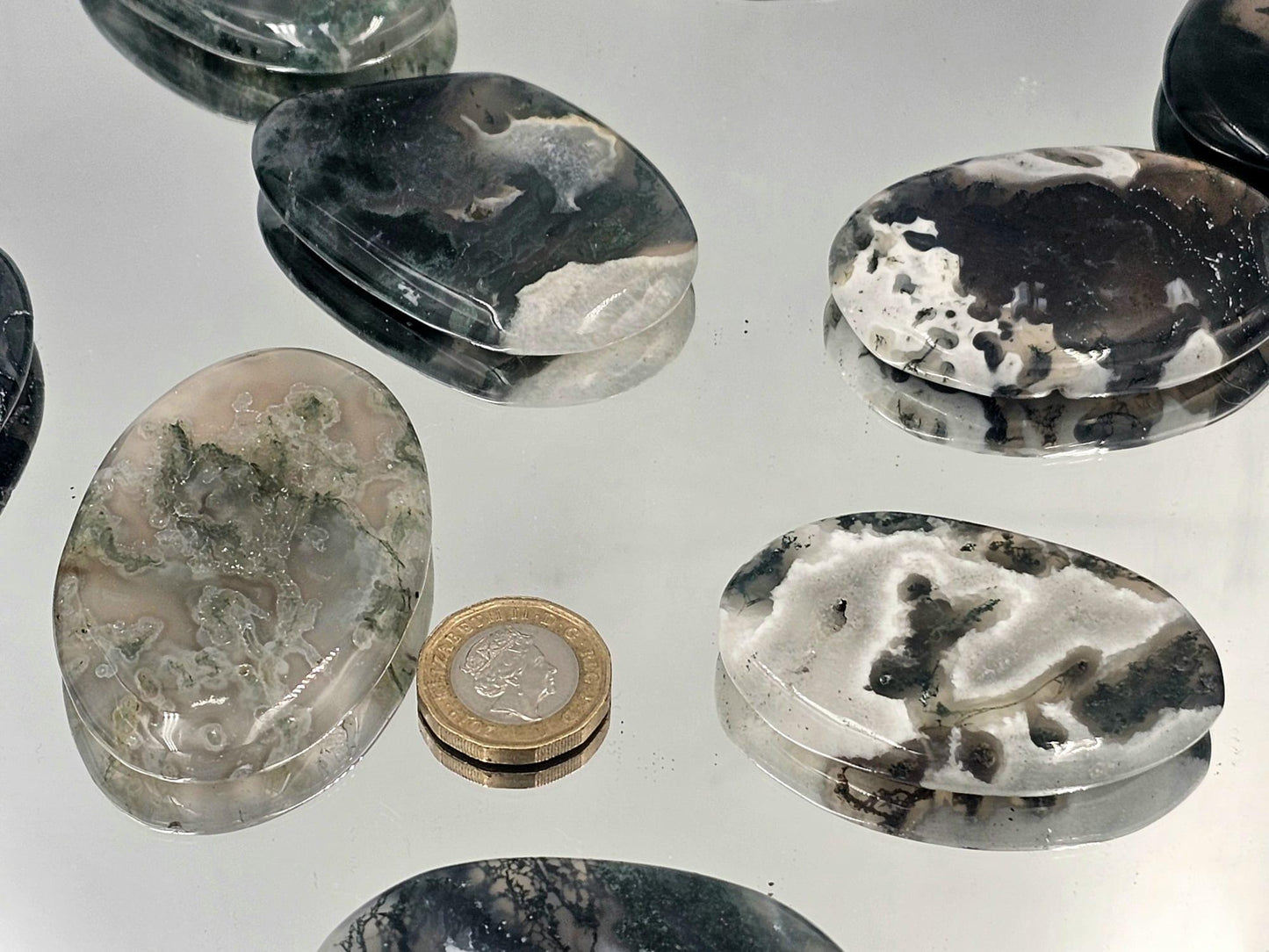 Green Moss Agate palmstones, ideal for crystal collectors.