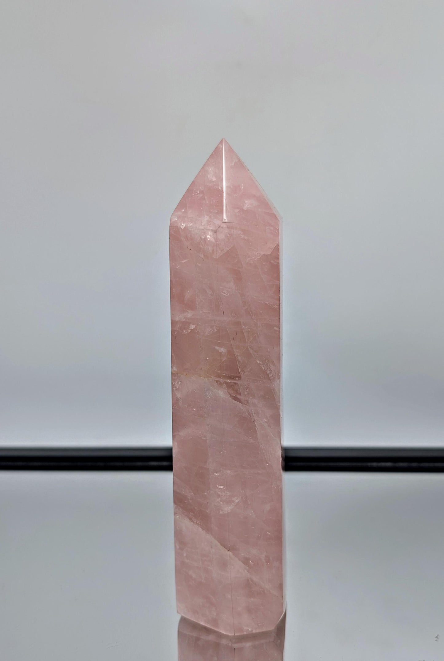 Stunning large rose quartz prism from Madagascar, ideal for elegant display spaces.