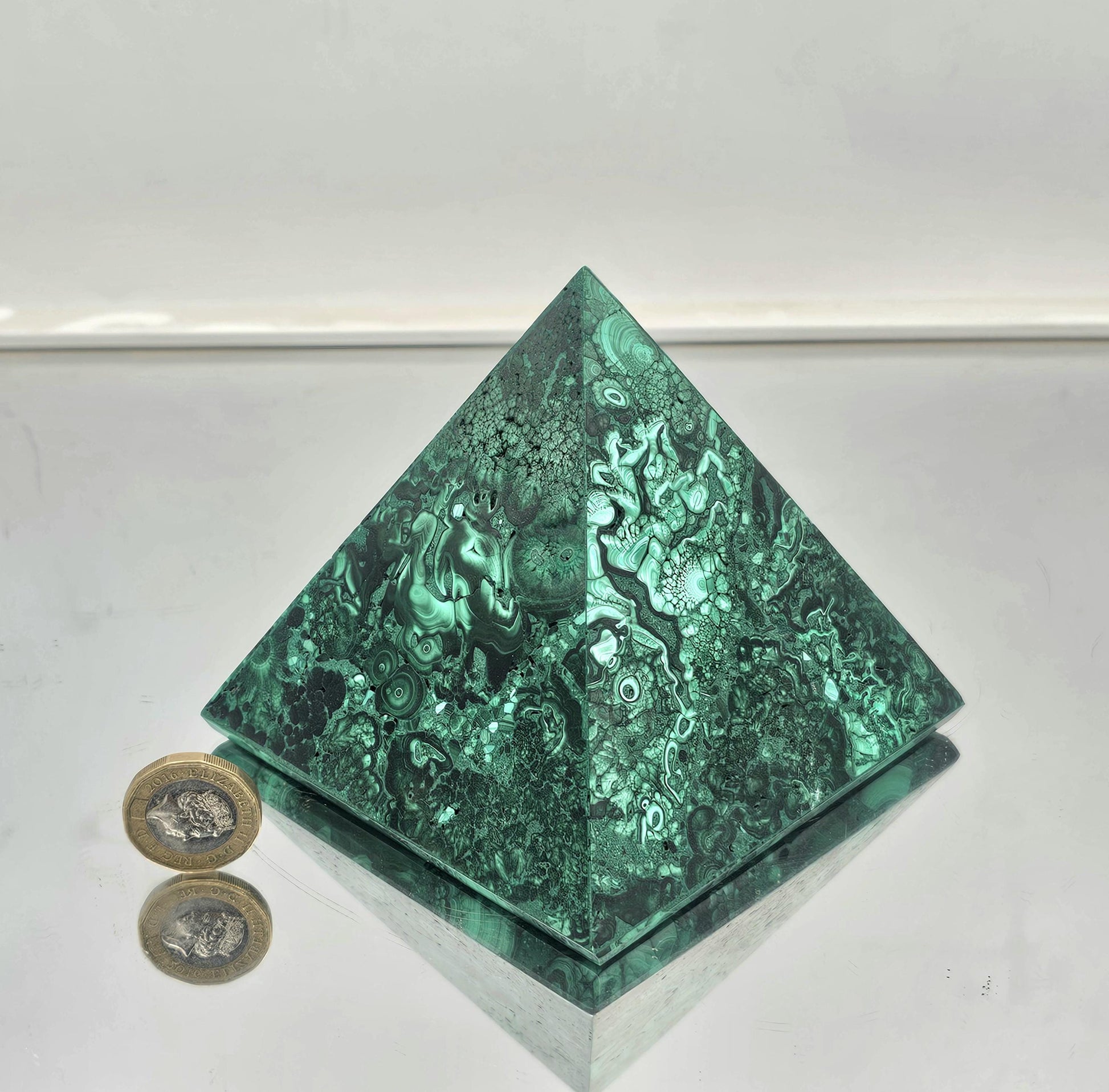 small handcrafted malachite pyramid centerpiece for high-end home décor.