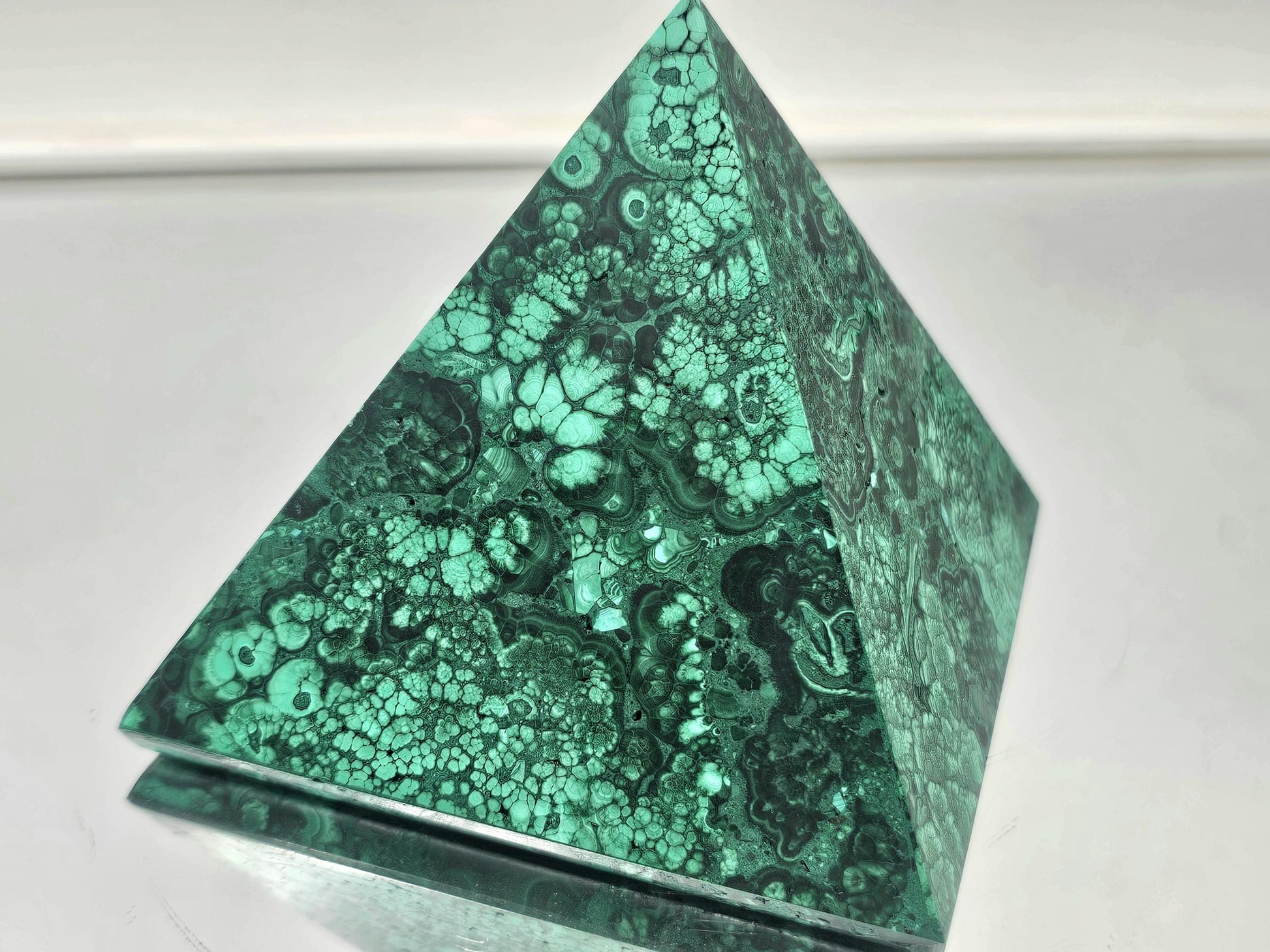 small malachite pyramid with stunning green hues for elegant interiors.