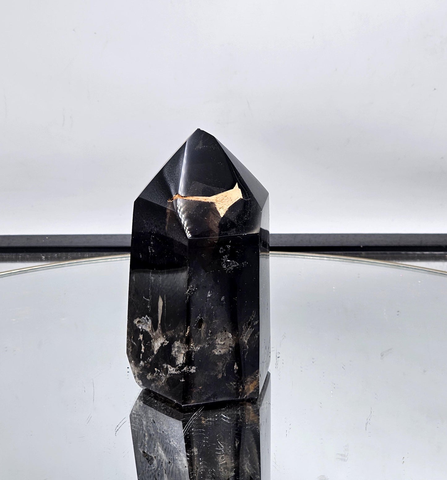 Deep smoky quartz tower, perfect for interior décor.