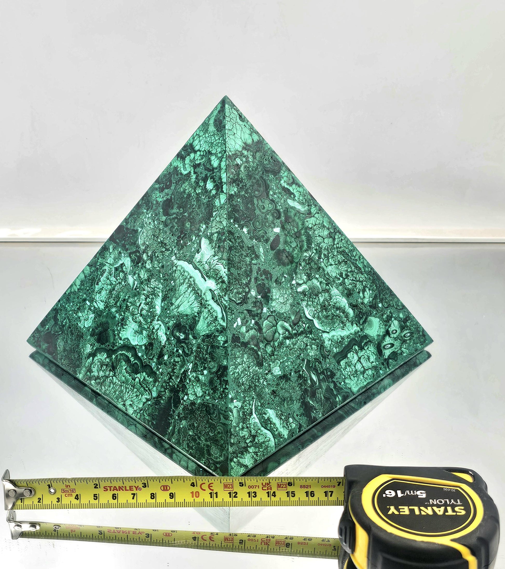 Unique large malachite pyramid ideal for crystal collectors and interior design.