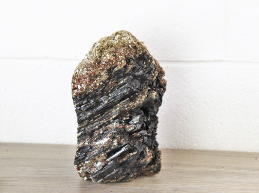 large black tourmaline crystal with mica