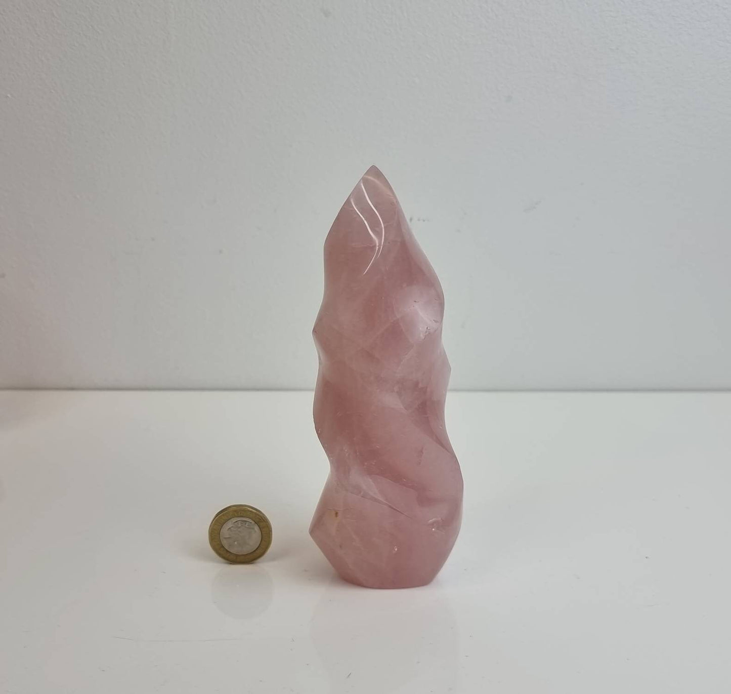 pink rose quartz crystal carving flame